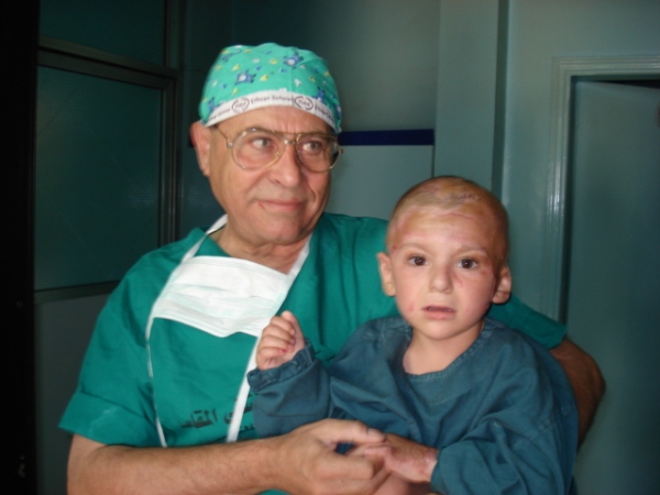 Doctor with young burns patient