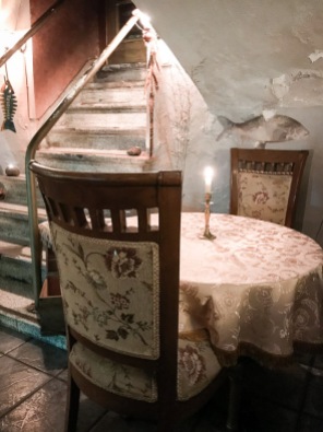 Candle on table with chair in restaurant
