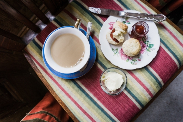 tea and scones on a striped chair