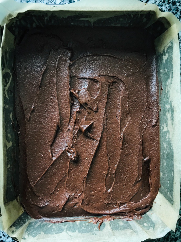 brownie mix in a baking tin levelled out