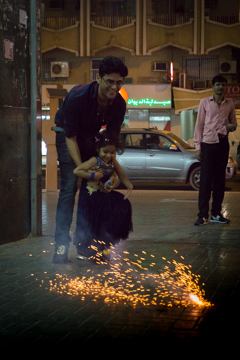 man and child with firecracker