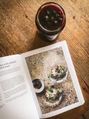 The Modern Preserver's Kitchen cookbook and some ingredients